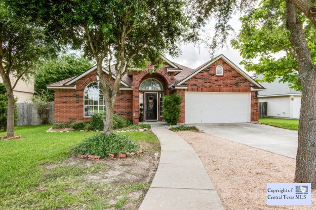 2230 North Ranch Estates Boulevard New Braunfels, TX 78130 - Photo 1 of 1 a front view of a house with a garden and yard