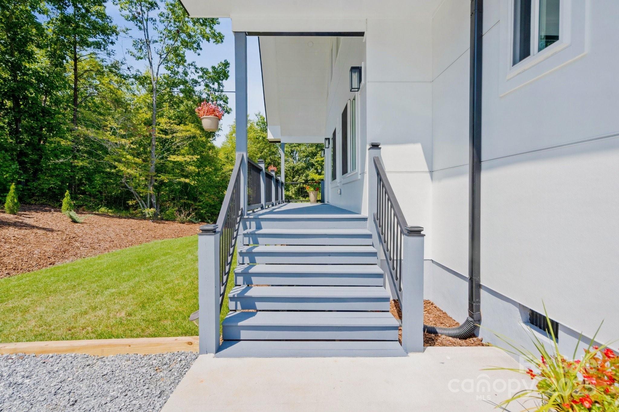 456 Hickory Loop Road Rutherfordton, NC 28139 - Photo 11 of 38 a view of a balcony with flower plants