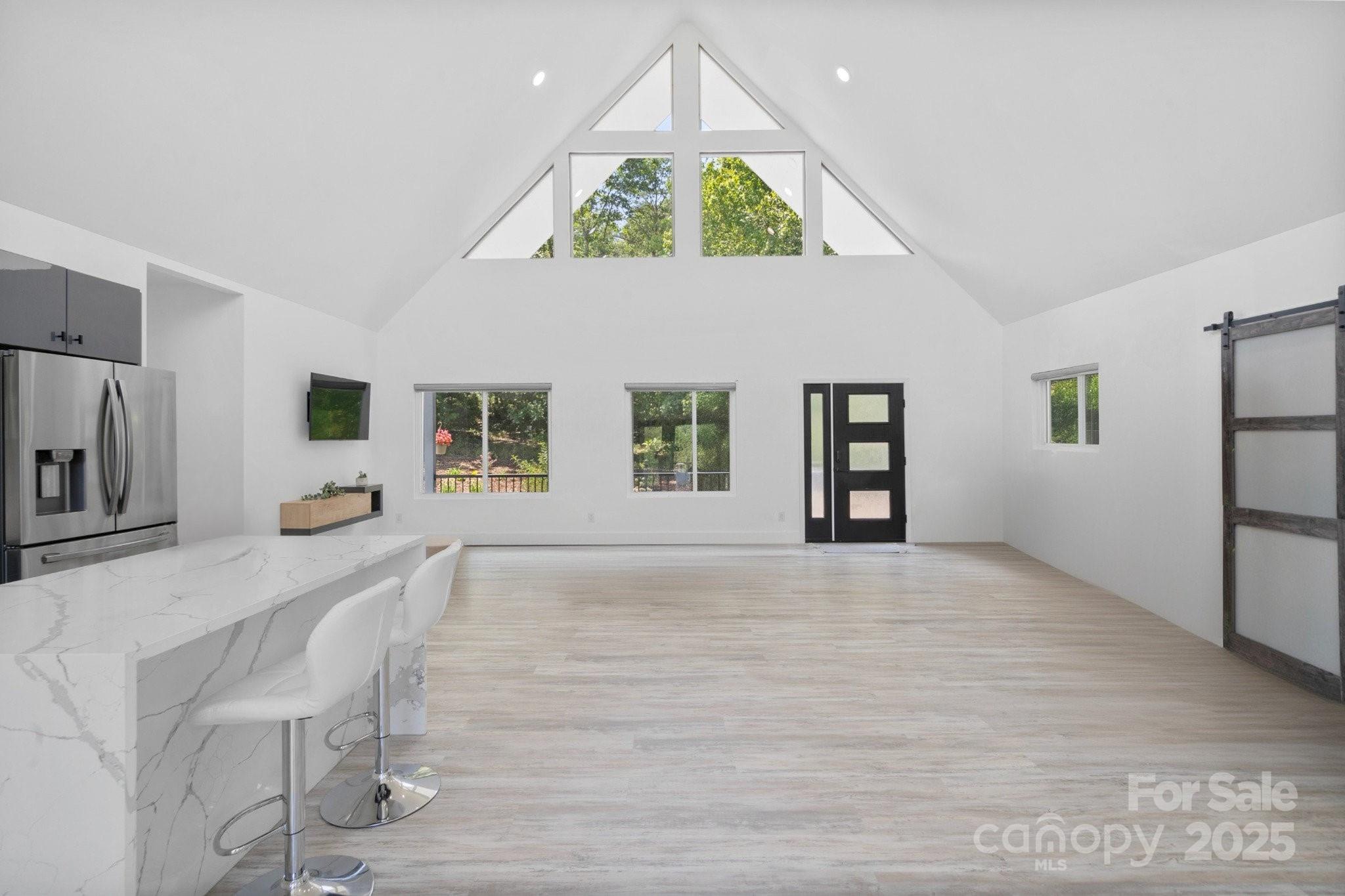 456 Hickory Loop Road Rutherfordton, NC 28139 - Photo 15 of 38 a view of an empty room with window and wooden floor