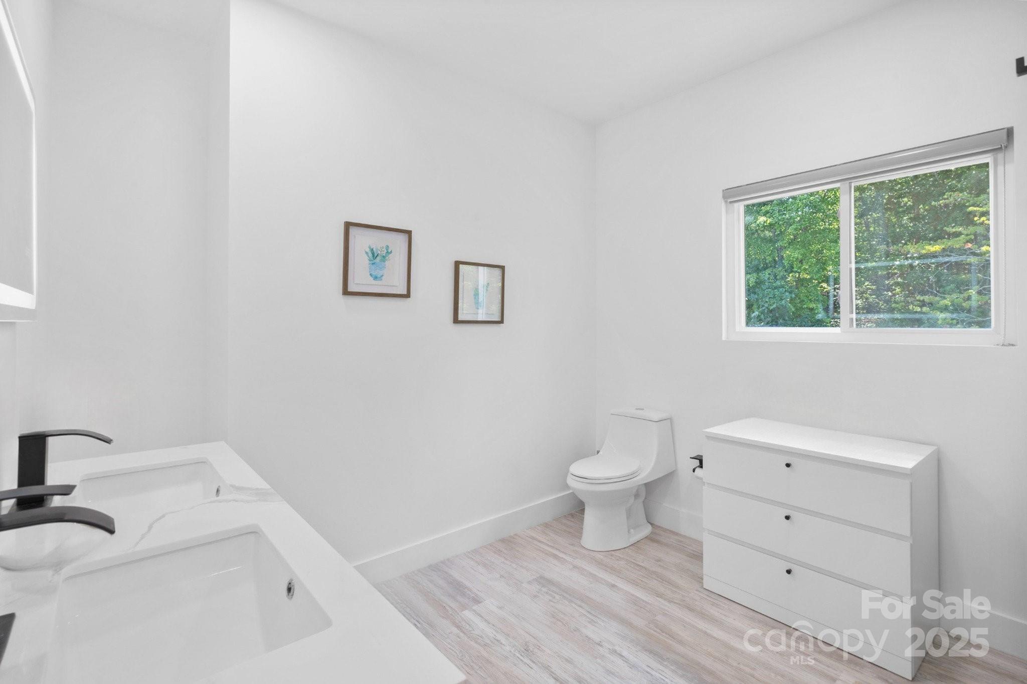 456 Hickory Loop Road Rutherfordton, NC 28139 - Photo 22 of 38 a bathroom with a toilet sink and a window