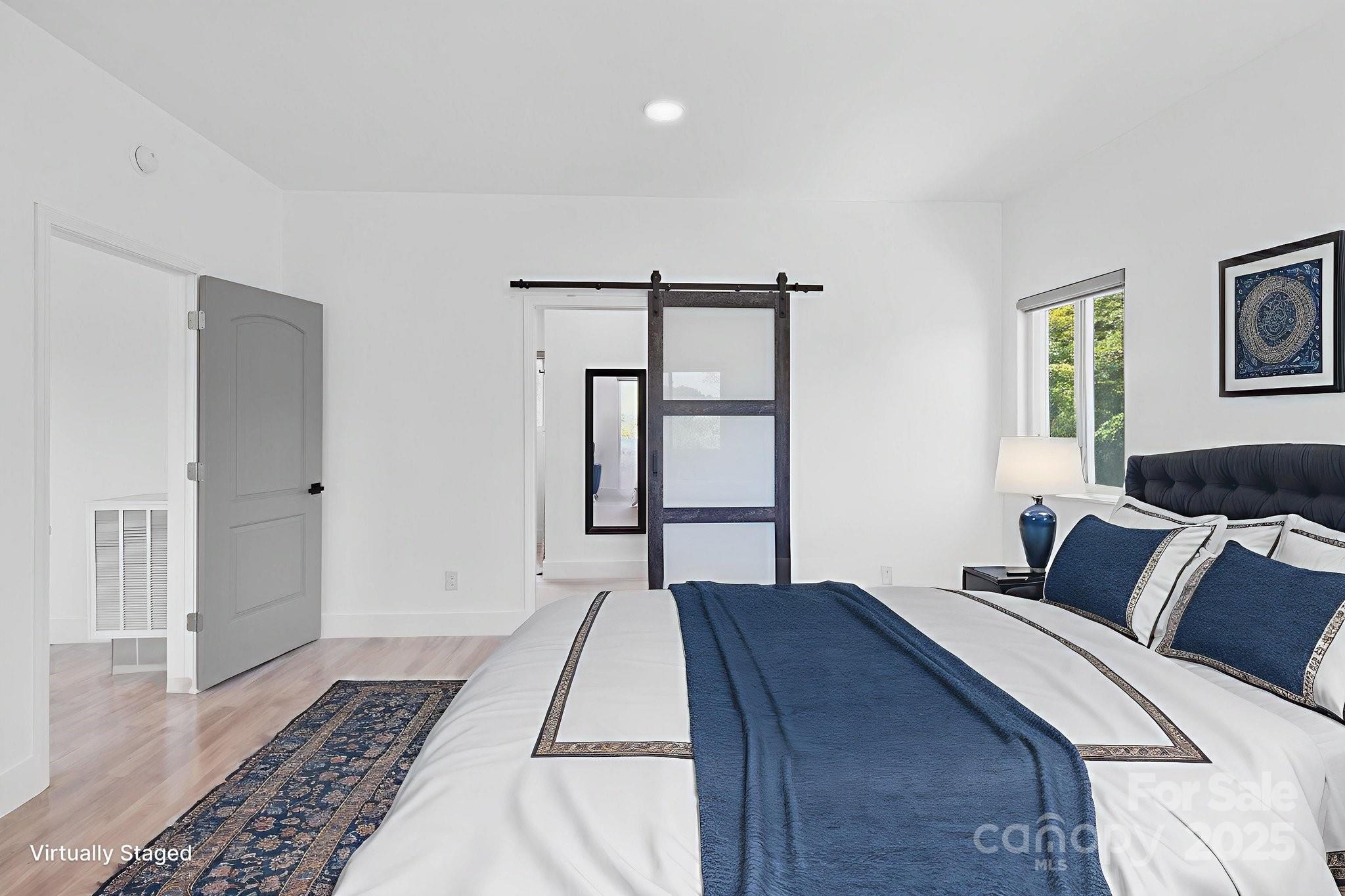 456 Hickory Loop Road Rutherfordton, NC 28139 - Photo 25 of 38 a bedroom with a bed and a window