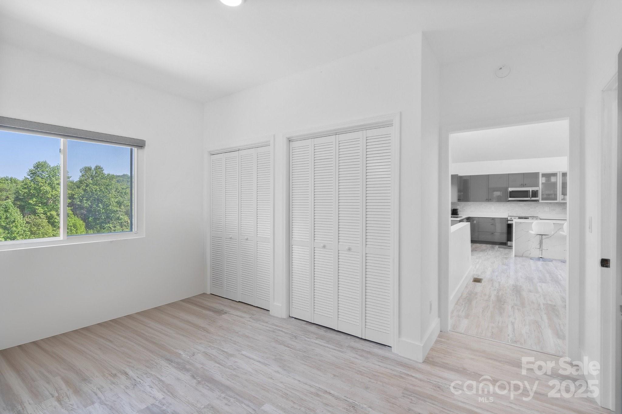 456 Hickory Loop Road Rutherfordton, NC 28139 - Photo 26 of 38 a view of a kitchen with wooden floor and a window
