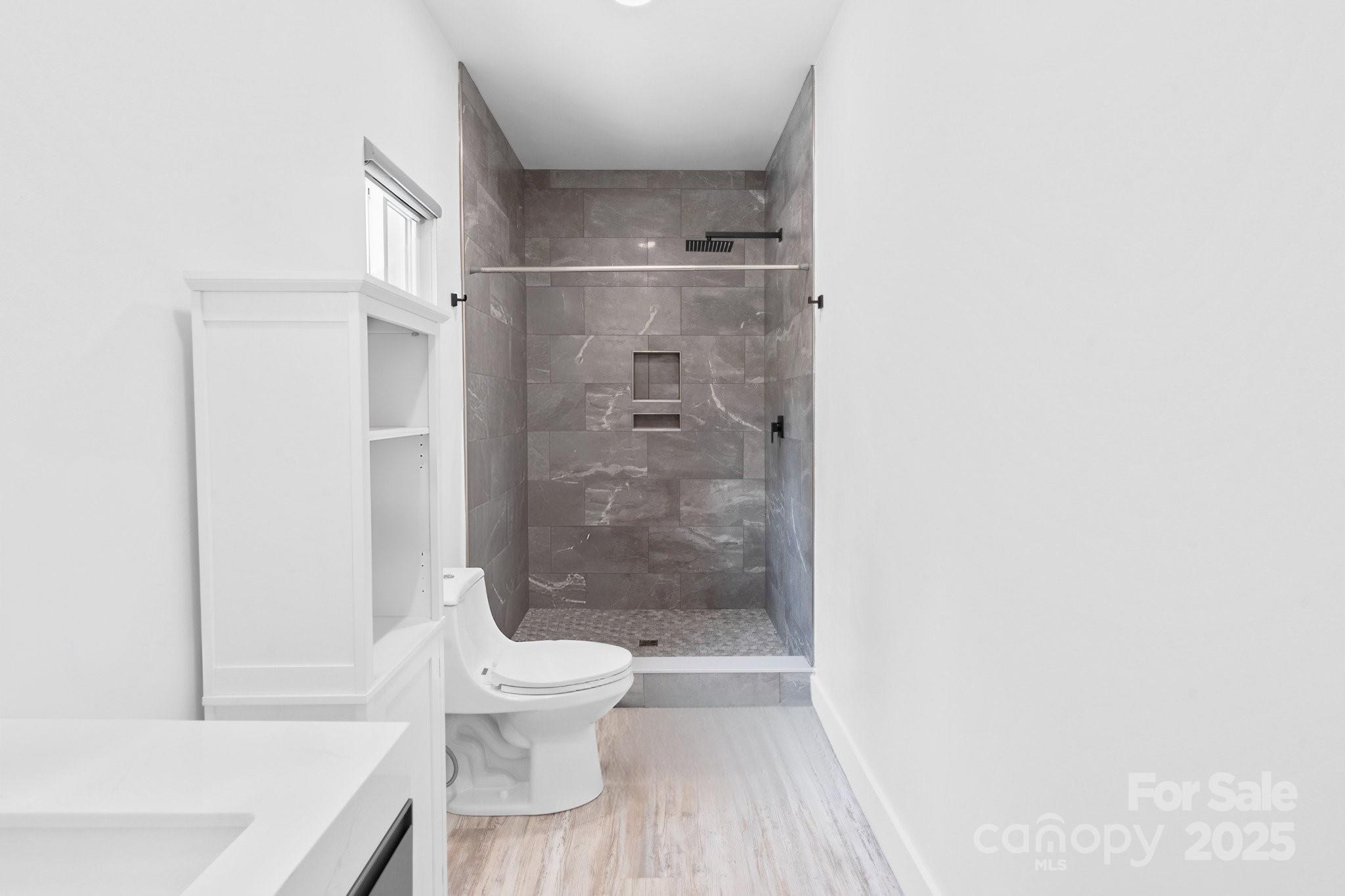 456 Hickory Loop Road Rutherfordton, NC 28139 - Photo 28 of 38 a bathroom with a toilet and a shower