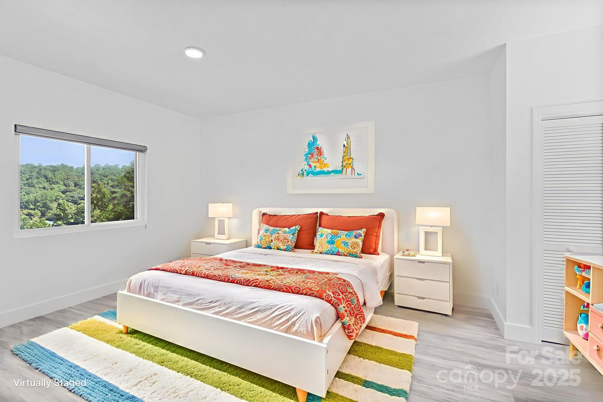 456 Hickory Loop Road Rutherfordton, NC 28139 - Photo 31 of 38 a bedroom with a bed and a painting on the wall