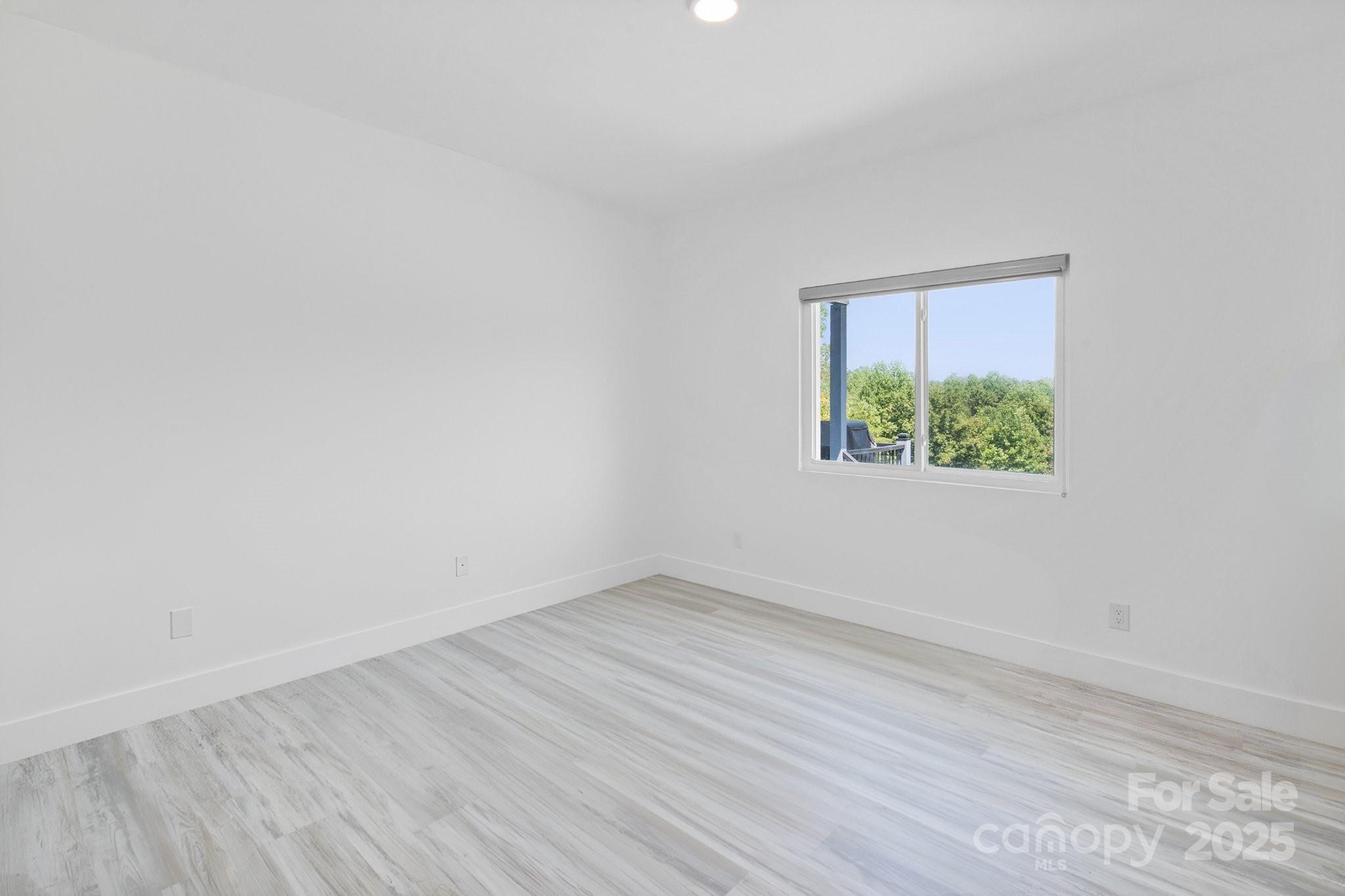 456 Hickory Loop Road Rutherfordton, NC 28139 - Photo 32 of 38 an empty room with a window