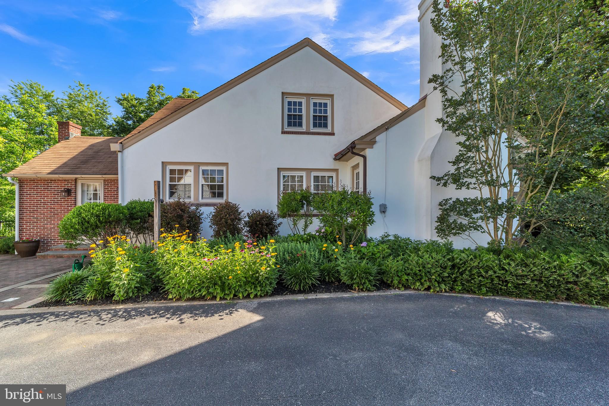 911 Sconnelltown Road West Chester, PA 19382 - Photo 28 of 28 Welcoming perennial flower beds beside house