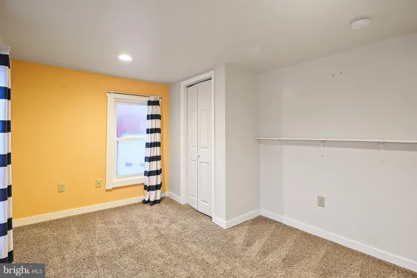 a bathroom with a shower and a sink