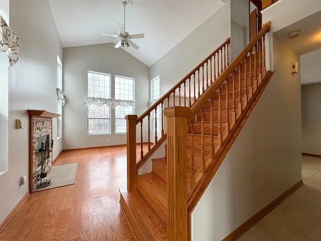 a view of an entryway with wooden floor windows and a livingroom