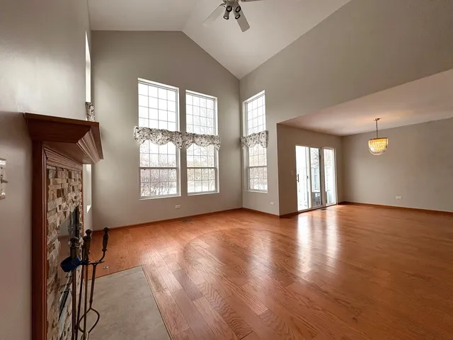 a view of livingroom with hardwood floor and a ceiling fan