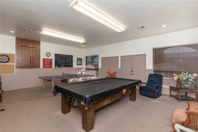 a view of a livingroom with furniture and a ceiling fan