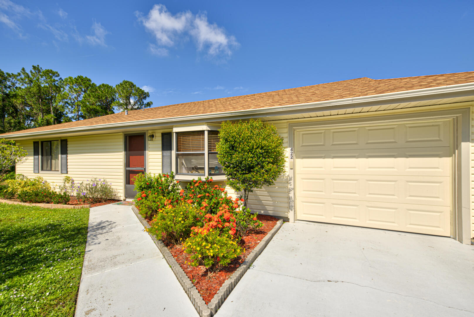 422 Avocado Road Northwest Palm Bay, FL 32907 - Photo 1 of 27 walkway to front door & garage