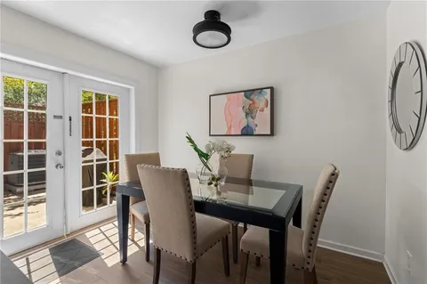 a view of a dining room with furniture and a window