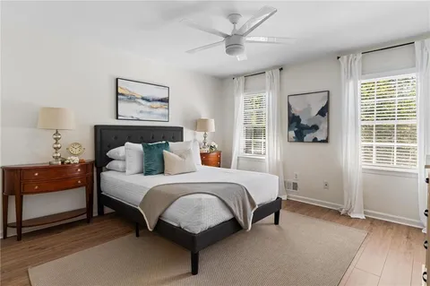 a spacious bedroom with a bed and a window