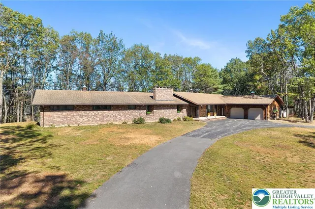 a view of a swimming pool with an outdoor space and seating area
