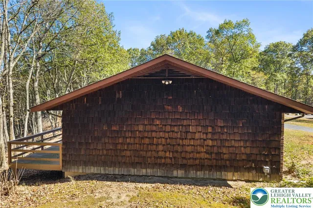 a view of a balcony with wooden floor and outdoor space