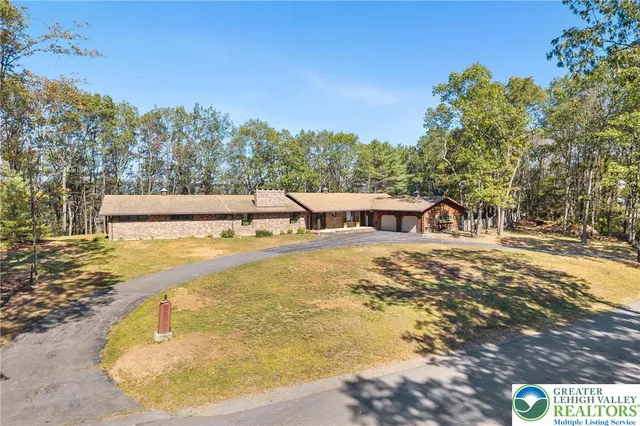 a view of a swimming pool with an outdoor seating