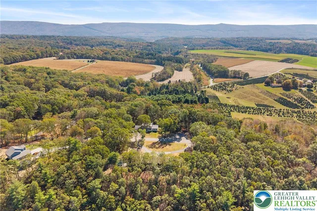 a kitchen with kitchen island granite countertop a sink cabinets and stainless steel appliances