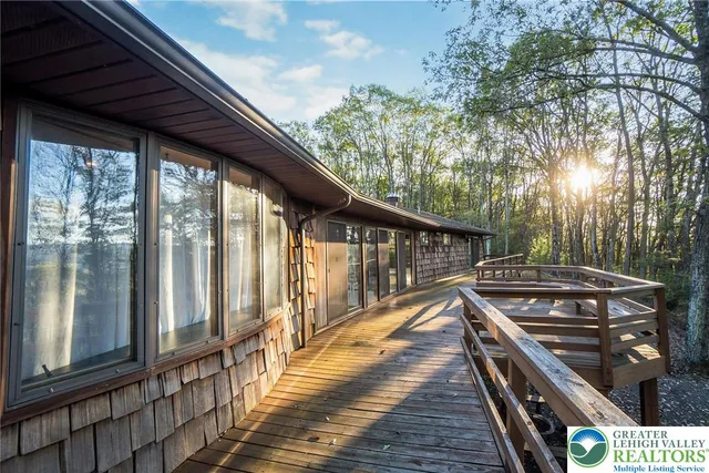a spacious bedroom with a bed and a window