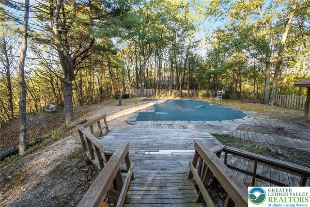 a spacious bedroom with a bed and a window