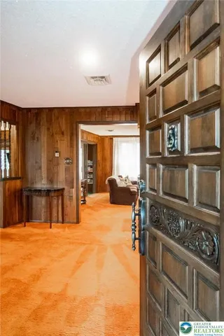 a view of front door and bedroom