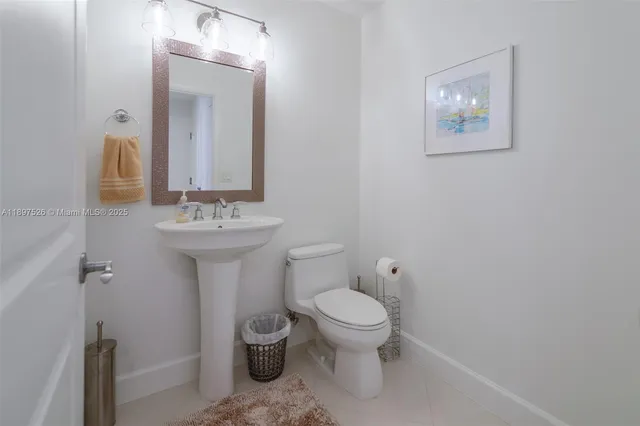 a bathroom with a double vanity sink a mirror and a