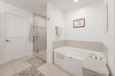 a bathroom with a bathtub and a shower