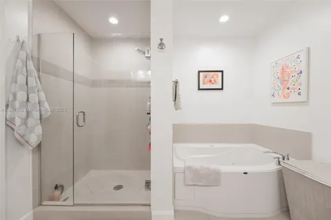 a bedroom with a bed and a lamp