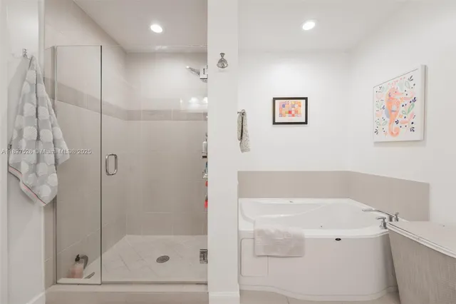 a bedroom with a bed and a lamp