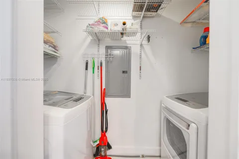 a lobby with furniture and a mirror