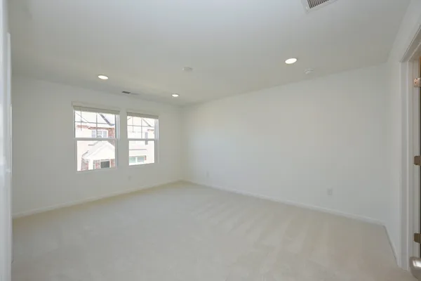 a bathroom with a sink a toilet a mirror and vanity