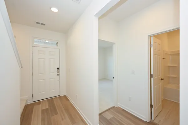 a bathroom with a window and a shower