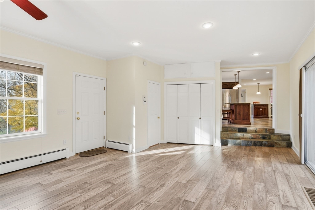 68 Monson Road Wilbraham, MA 01095 - Photo 11 of 39 an empty room with wooden floor and windows