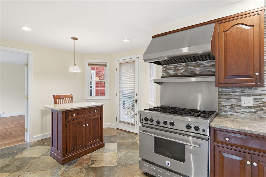 68 Monson Road Wilbraham, MA 01095 - Photo 15 of 39 a kitchen with granite countertop a stove and a sink