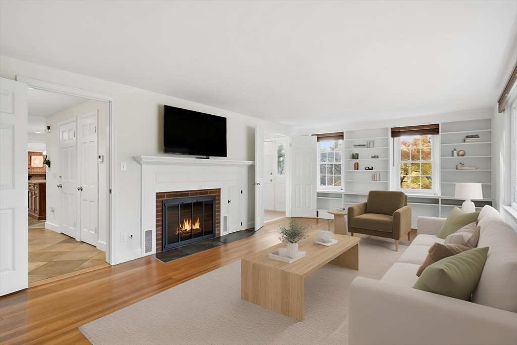 68 Monson Road Wilbraham, MA 01095 - Photo 3 of 39 a living room with furniture a flat screen tv and a fireplace
