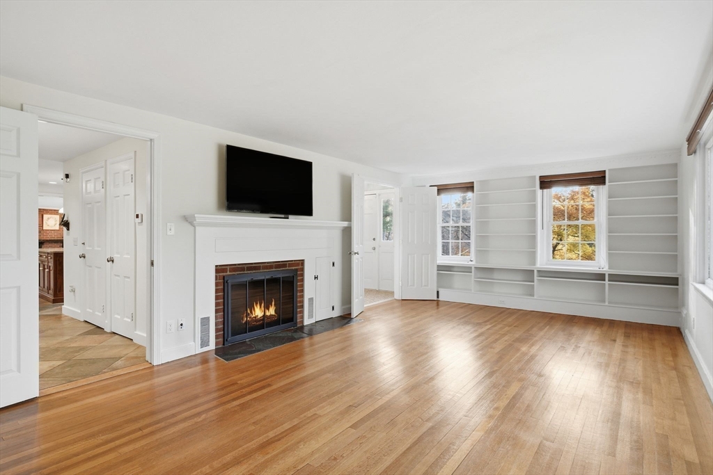 68 Monson Road Wilbraham, MA 01095 - Photo 4 of 39 wooden floor fireplace and windows in an empty room