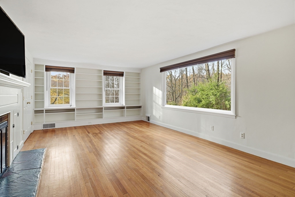 68 Monson Road Wilbraham, MA 01095 - Photo 6 of 39 an empty room with wooden floor and windows