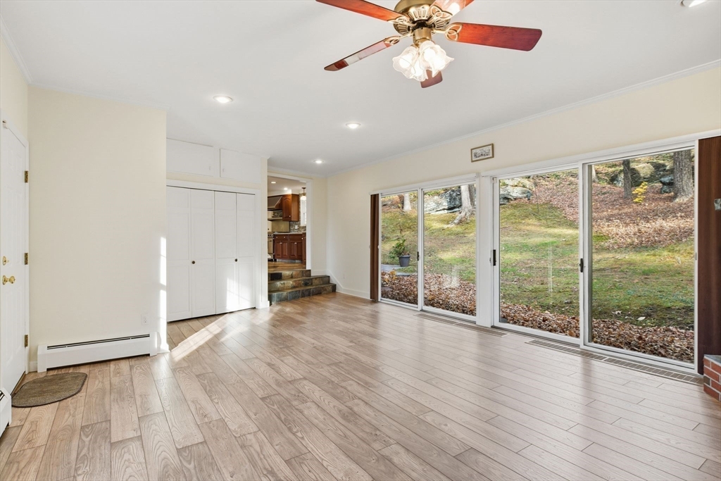 68 Monson Road Wilbraham, MA 01095 - Photo 10 of 39 a view of an empty room with wooden floor and a window