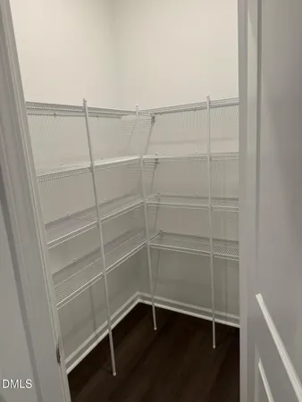 a view of a room with racks on the wall