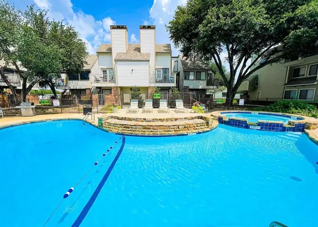a swimming pool with outdoor seating and yard