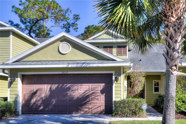 a view of a house with a tree