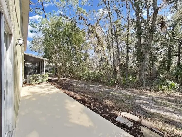 a view of a room with wooden floor and closet area
