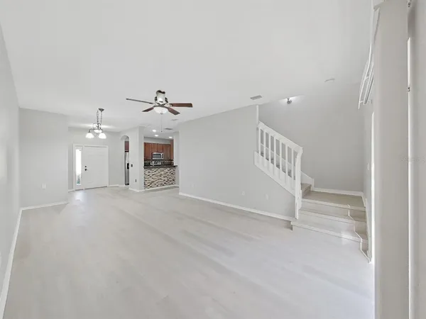 a view of an empty room with a fireplace