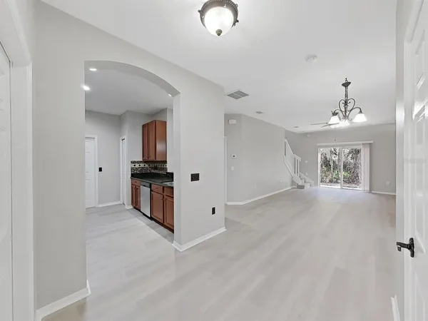 a view of kitchen with sink cabinet and window