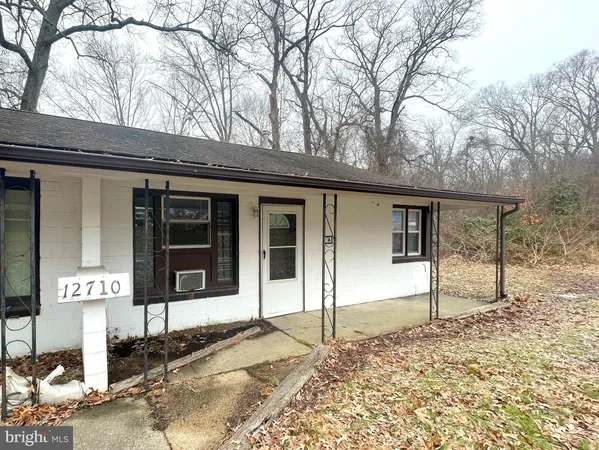 a house with trees in front of it