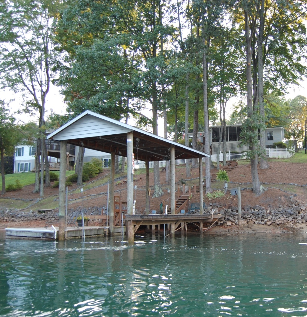 180 Cove Road Penhook, VA 24137 - Photo 25 of 33 a view of swimming pool with lawn chairs under an umbrella