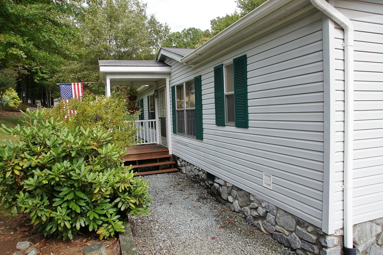 180 Cove Road Penhook, VA 24137 - Photo 31 of 33 a front view of a house with a garden