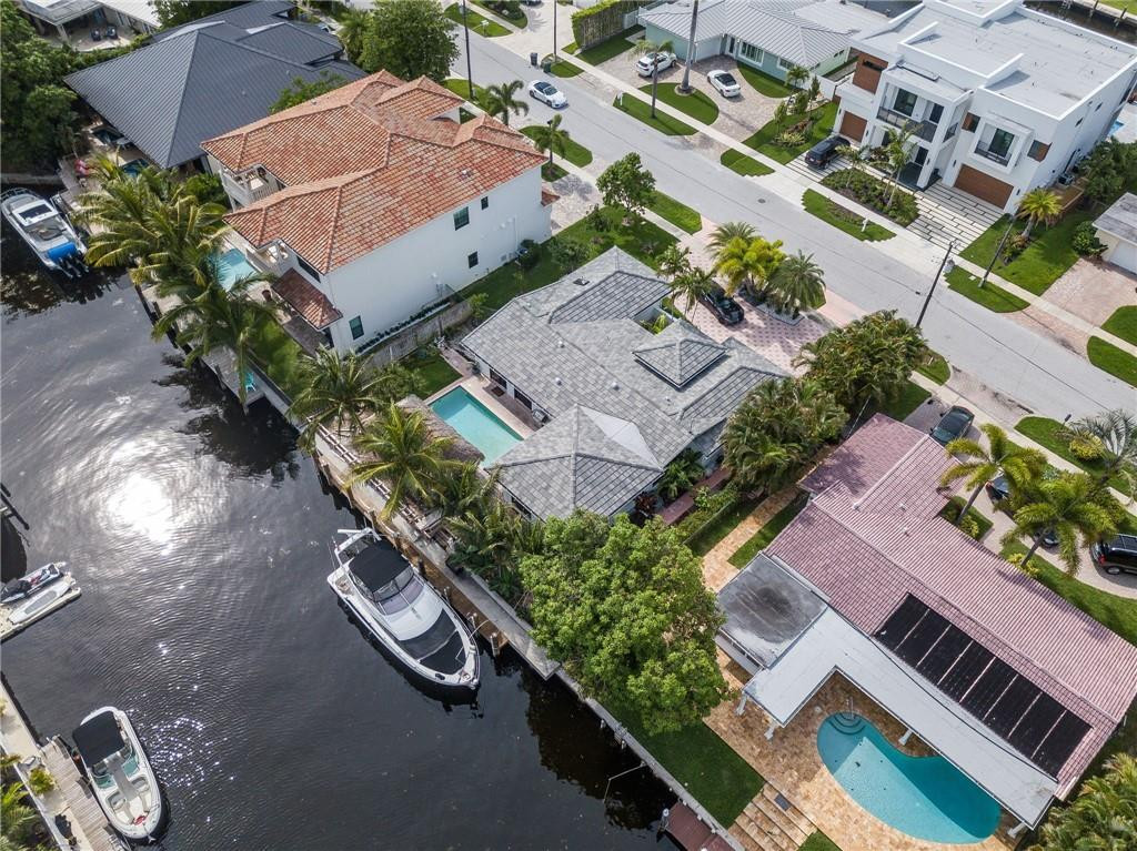 730 Northeast 69th Street Boca Raton, FL 33487 - Photo 1 of 32 an aerial view of a house with a yard