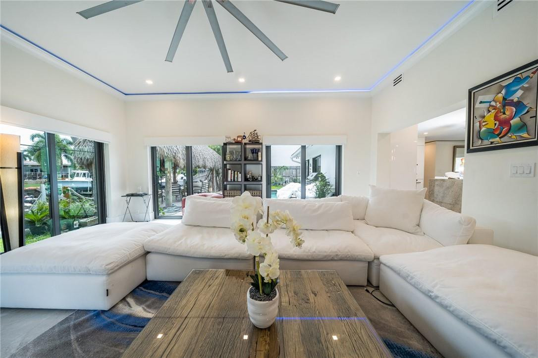 730 Northeast 69th Street Boca Raton, FL 33487 - Photo 12 of 32 a living room with furniture and a large window