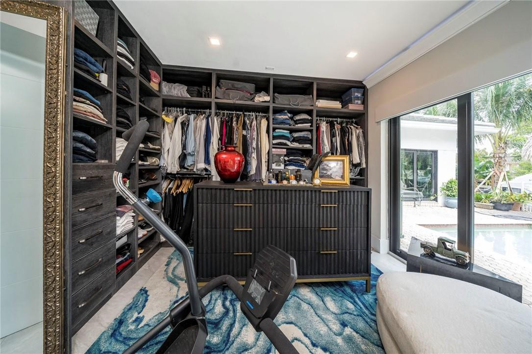 730 Northeast 69th Street Boca Raton, FL 33487 - Photo 15 of 32 a view of a room with gym equipment