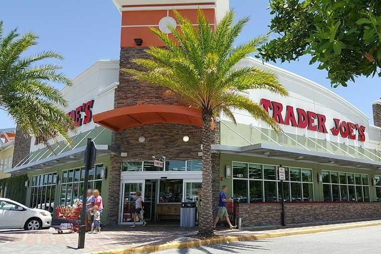 730 Northeast 69th Street Boca Raton, FL 33487 - Photo 31 of 32 a front view of a building with garden